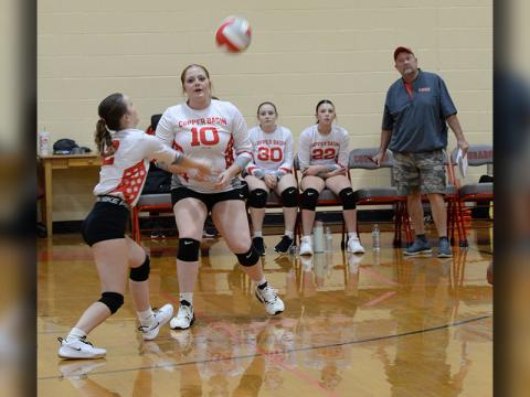 Savanna Bloodworth and Claire Ledford (#10) are shown in recent action for the Lady Cougars.