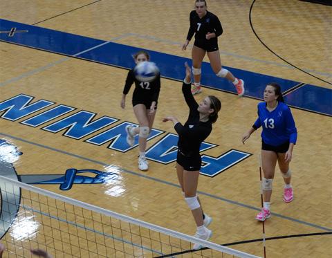 Kaylie Davenport (#1) lines up a return for the Lady Rebels. Also shown are Keslie Key (#12) and Maggie Ledford (#7). 
