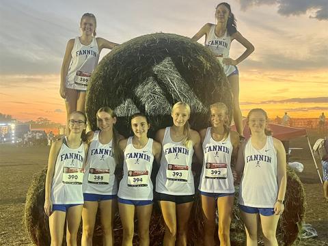 The Fannin County girls cross country team, from left, standing,  Sydney Ford, Lila Borum, Karli Sams, Kensley Pickelsimer, Lindsey Holloway and Claire Saxon; and, top, Annaleigh Cheatham and Lana Hicks ran in the nighttime Championship Race at Wingfoot.