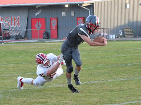 Copper Basin’s Lucas Hughes escapes the grasp of a Whitwell tackler last Monday. Against Mt. Bethel Christian Academy Friday night, Hughes ran for 110 yards and scored one of the Cougars’ three touchdowns.