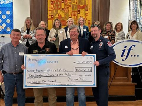 Representing Fannin County Volunteer Fire and Rescue as they accept their donation from Impact100 Fannin are, from left, Fannin County Commission Chairman Jamie Hensley, Fire Chief Larry Thomas, Rick Glueckert and Michael Cornelius.