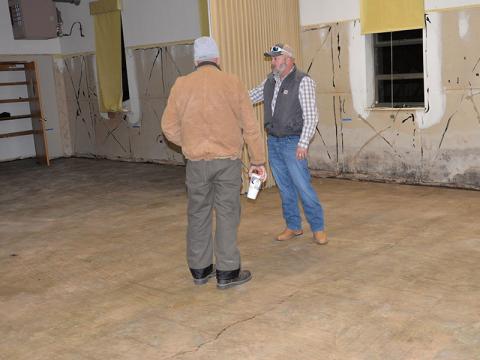 Polk County Executive Robby Hatcher shows Copper Basin Fire Chief Marty Senterfitt the progress being made at the Copper Basin Community Center.