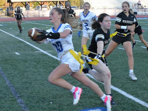 Makenzie Duvall reaches for as much yardage as possible for the Fannin County High School flag football team.