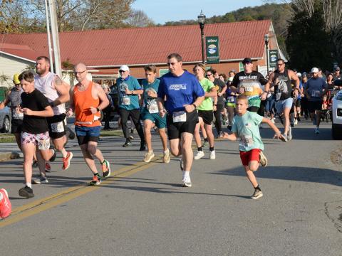 The Riverwalk Run Series is a group of three, 5K races that covers two states and attracts a wide variety of runners. This group has just left the starting line at the November 2 Bigfoot Boogie.