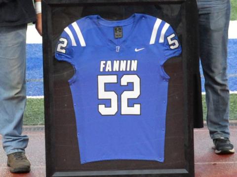 John Holsonback’s framed football jersey was presented to his family during senior night.