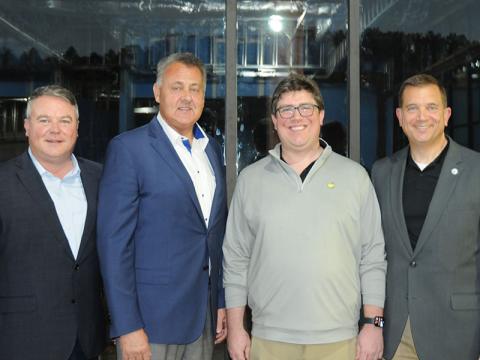 Spiro Amburn, former chief of staff for the late Georgia House Speaker David Ralston, Georgia State Senator Steve Gooch, Matthew Ralston, the son of Speaker Ralston, and University of North Georgia President Dr. Michael Shannon, from left, stand inside the school’s upcoming David E. Ralston Hall on the Blue Ridge Campus.