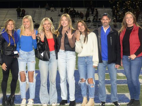 Championship rings were presented to members of the Fannin County Lady Rebels 4x800 meter relay team Friday night for their 2024 state title victory. Shown during the ceremony are, from left, Coach Miranda Roof, Lindsey Holloway who ran the first leg, second leg runner Carlee Holloway, Ava Acker who ran the third leg, anchor leg runner Karli Sams, Coach Dr. Lucas Roof and Coach Alden Falls.