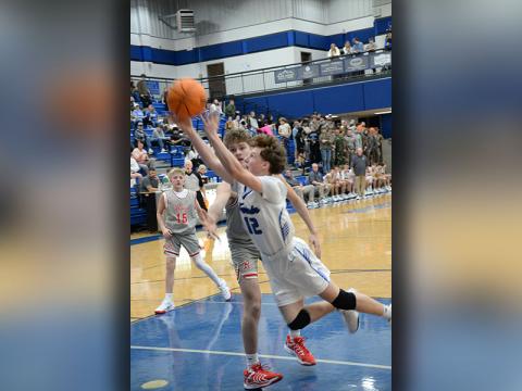Fannin County’s Jasper Mealer (12) stretches for a basket against the Copper Basin Cougars in action Tuesday night, December 17, at the Fannin County High School gym.