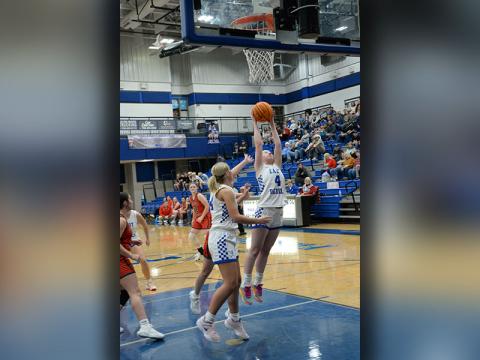 Fannin County’s Emma Buchanan (4) stretches for a rebound against Copper Basin Tuesday night, December 17. Backing her up is Emma Holloway.