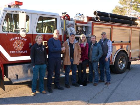 Shown during the presentation of the keys are, from left, Dr. L.B. Bryson of the CBFD, CBFD Fire Chief Marty Senterfitt, Third District commissioners Mush Davis, Samantha Trantham and Keith Barker, and County Executive Robby Hatcher. The truck will be housed at the Grassy Creek station. 