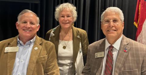 State Representative Johnny Chastain, left, was joined by House Natural Resources and Environment Chair Lynn Smith and Representative Stan Gunter in celebrating the committee’s fishing report.