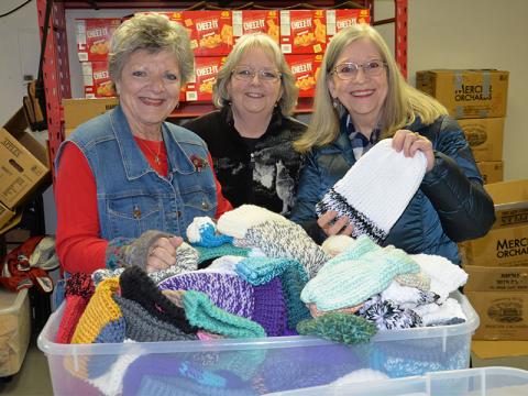 These three “Knitwits” from Faith Presbyterian Church delivered 529 handmade, knitted hats to Snack in a Backpack last week to be given to Fannin County School children. Kim King, Frances Thompson and Betty Benedict, from left, are part of the group that call themselves the Knitwits and gather regularly to make the hats.