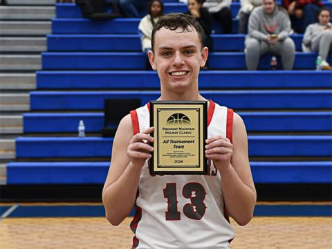 Copper Basin’s Carder Lance holds his All Tournament Team award.