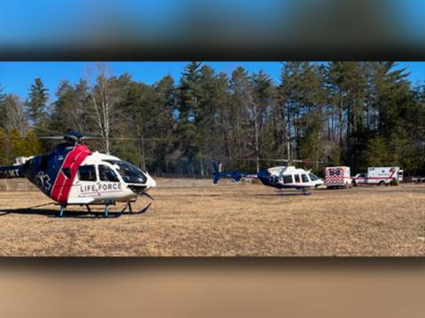 Two Lifeforce helicopters prepare to transport the victims of a house fire in the Doublehead Gap Road area. Despite the remote location, the first firefighters arrived on the scene in 11 minutes.