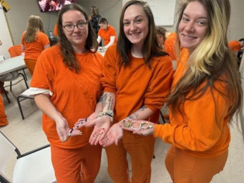 Kayla Sylvester, Emilie Bolling and Hallie Thomason, from left, show off some of the bracelets they have just finished making that will accompany members of The Ridge Community Church on a mission trip to the Dominican Republic.