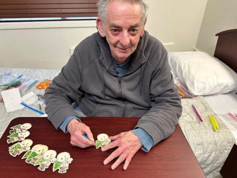 PruittHealth of Blue Ridge resident, Roy Hooker helped make Christmas ornaments for the victims of Hurricane Helene in Asheville, North Carolina.