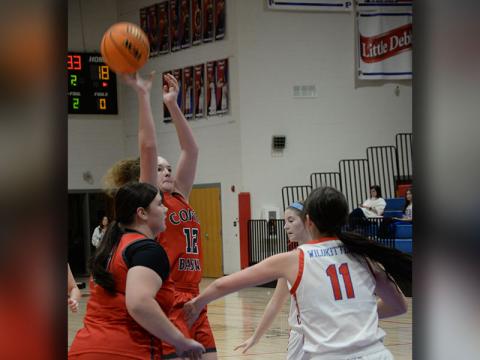 Kloie Ballew goes for two points with Alyvia Harris ready for the followup for Copper Basin.