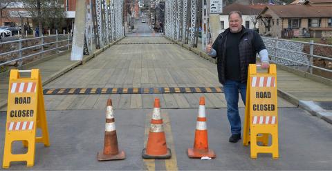 Mike Galinski, owner of the Riverwalk Shops complex, was all thumbs up when the iconic steel bridge spanning the Toccoa River and connecting the twin cities of McCaysville and Copperhill was re-opened after extensive repairs. 