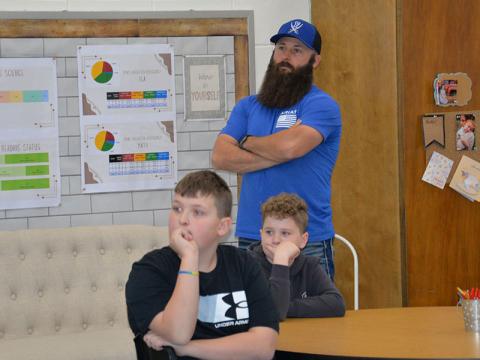 School board member Robert Patterson is joined by, seated, Izaiah Bradburn (left) and Brantley Barton.
