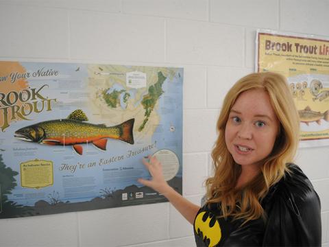 Blue Ridge Elementary School BRES) STEM teacher Tori Arp points to a brook trout poster.