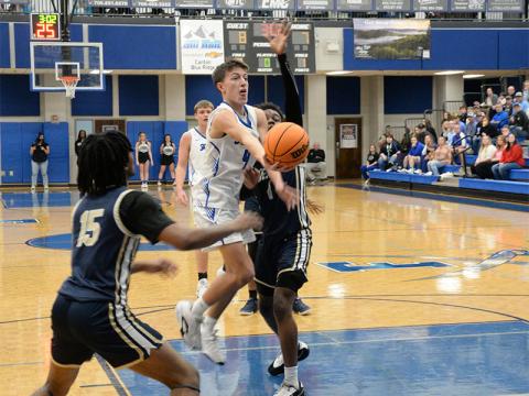 Matthew Ponton fight down the lane as he aims for two points against BEST Academy’s Eagles.