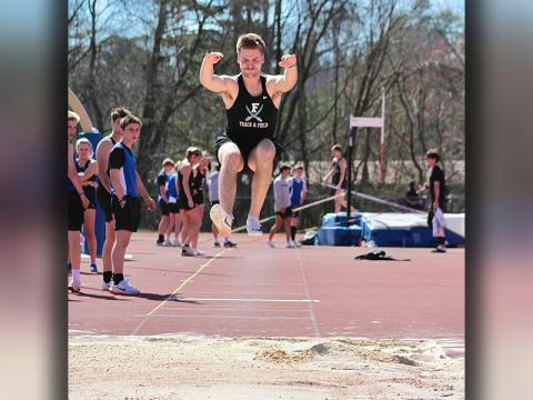 Fannin County’s Cooper Hilliard gets good distance in long jump competition against Pickens County.