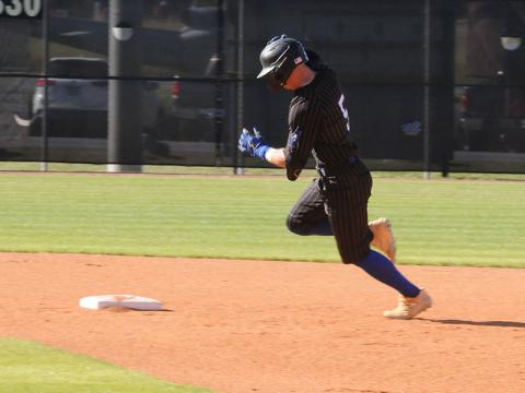 Fannin County’s Carson Callihan sprints for second base in an April 15 home game.