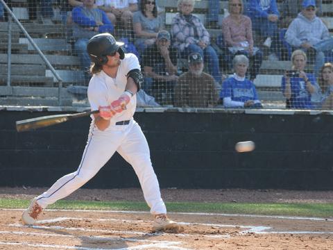 Rebels senior Colton Gray swings at a ball in an April 1 game against Gordon Lee.