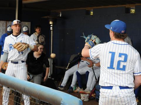 Gavin Davis, left, and Eli Queen, right, practice as they wait for weather to clear for a game scheduled March 13.