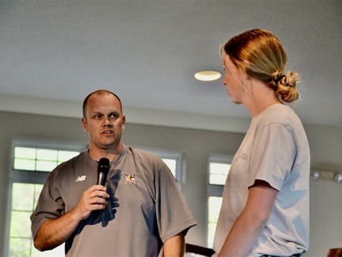 Matt Queen, 515 Fellowship of Christian Athletes director, introduces new Ambassador Morgan Holt during a fundraising event featuring former University of Georgia football Head Coach Mark Richt Tuesday, April 22.