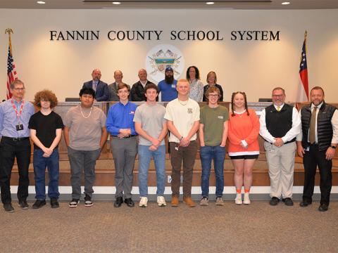 Fannin County High School TSA members, from left, front, CTAE teacher Parry Ruder, Chevy Phillips, Kevin Tzun, James Burrell, Kyle Conner, Aiden Carder, Castle Barnett, Fox Sharp, CTAE Supervisor David Henson and Principal Dr. Scott Ramsey; back, board members, Chairman Mike Cole, Bobby Bearden, Adam Born, Robert Patterson, Ashley Herendon-Weeks and Superintendent Shannon Dillard.
