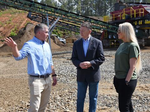 Jon Neumann, vice president of Material Sales Company, talks about the potential of the Copperhill Quarry with State Representative Dan Howell, center, and Polk County District Three Commissioner Samantha Trantham.