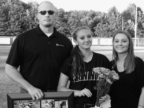 Candace German is shown with her parents during the Fannin County Lady Rebels senior night recognition. She played varsity softball for four years, beginning with the 2009 season and ending when she was a senior.