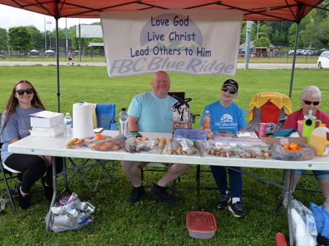 Several churches were set up at Fannin County Park during Her Hope Pregnancy Center’s Walk for Life fundraiser Saturday, June 7. Abby Noblitt, Tim Smallwood, Debbie Jones and Pat Young, from left, represented First Baptist Church of Blue Ridge.