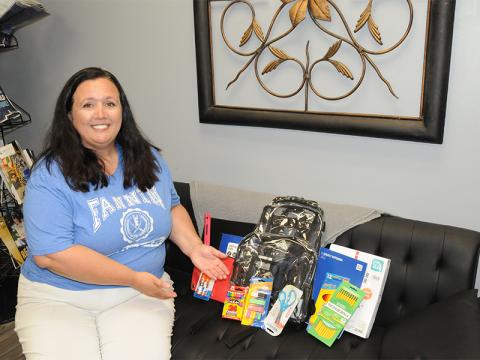Tara Cantrell is pictured showing off a few of the many free school supplies that will be up for grabs at the Back to School Bash July 26. 