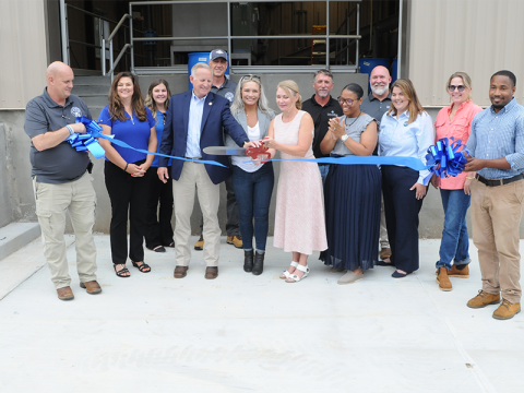 Blue Ridge public servants and others cut the ribbon at the Blue Ridge Wastewater Treatment Facility. Seen, from left, are Project Manager Denny Cook, Utilities Director Rebecca Harkins, Chrissy Garrison of Carter and Sloope, Representative Johnny Chastain, Plant Superintendent James Weaver, Council Member Christy Kay, Mayor Rhonda Haight, Shane Lawson of Carter and Sloope, Jamelle Cherry with Georgia Environmental Finance Authority (GEFA), Matt Smith of Carter and Sloope, Susan Lucki of GEFA, Lori Moore wi