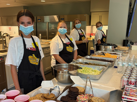 Adeline Beavers, Lyla Webb, Fannin County High School paraprofessional Maddie Mitchum, and Eleanor Hodgson, from left, served a meal at the Ronald McDonald House in Atlanta as part of a Family Career and Community Leaders of America project. The meal included cookies donated by the Sweet Shoppe of the South.