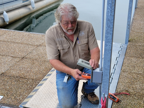 Fannin County Building Inspector Keith Nicholson checks a GFCI outlet on a dock at Lake Blue Ridge Marina.