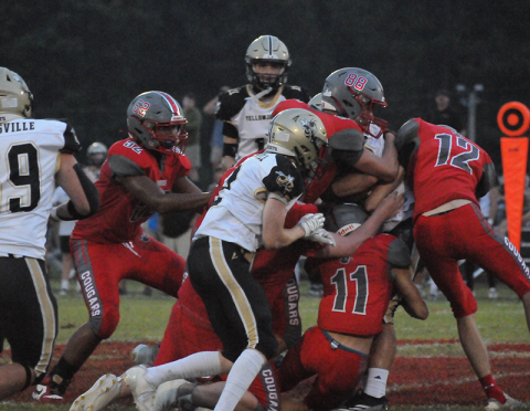 Copper Basin’s Darrius Harris (52), AJ Pero (88), Nick Bird (11) and Logan Cochran (12) team up to shut down a Hayesville runner Friday night at Copper Basin.