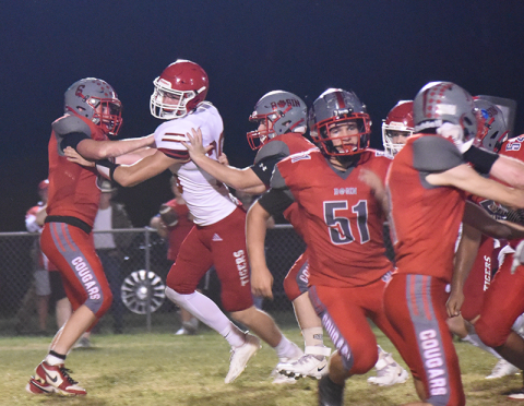 Drew Crowder (6), Logan Cochran, Thomas Seabolt (51) and Darrius Harris work to hold back the Whitwell defense in action Friday night at Copper Basin. 