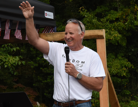 State Representative Johnny Chastain gestures to the crowd during the Fall Festival.
