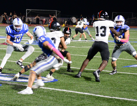 Fannin County’s Kason Brown, Brody Burnette and Casen Bailey maneuver to make a tackle in previous action this year. The trio are part of a defense whose starters held Armuchee to negative 11 yards Friday night.