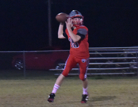 In previous Copper Basin action this year, Dawson Pittman (left photo) looks downfield and Cooper Floyd (right) comes up with a big tackle.
