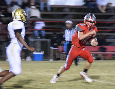 Copper Basin’s Nick Bird looks for running room against Lookout Valley Friday night.