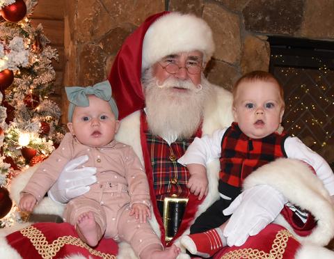Santa Claus made an earlier than usual appearance this year, welcoming young and old alike to Serenity in the Mountains Sunday to support the Tour of Trees fundraiser to benefit the Fannin County Sheriff’s Office Shop With A Cop. Here, Allen Dickey and Lainey Jo Watkins share Christmas wishes. The Tour of Trees returns for a second day this Sunday, November 23, from 2 p.m. until 5 p.m. at Serenity. 