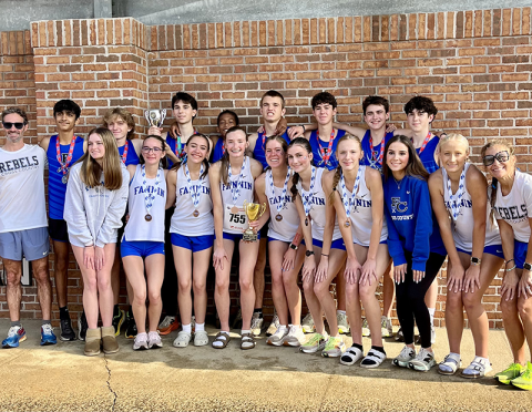 The Fannin County High School cross country boys and girls teams are shown following their successful trip to the State Championships. Shown with their awards are, from left, back row: Coach Dr. Lucas Roof, Jainil Patel, Aiden Jones, Winn Rickenbaker, Jamari Dunn, Rylin Davis, Henry Schueneman, Grey Ward, and Gabe Pirkle; and, front row, Addison Head, Sydney Ford, Charlotte Vallejo, Lola Temples, Maddie Schueneman, Garin Rickenbaker, Lana Hicks, Townson Rickenbaker, Kensley Pickelsimer,  and Coach Miranda R