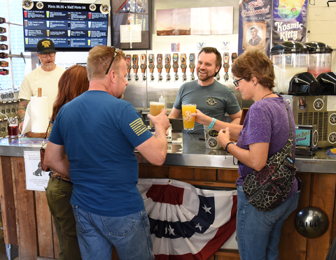 Jake Reuse serves up smiles and cold beer at Buck Bald Brewing in Copperhill. The award winning brews are favorites among the 250-plus regular customers who have joined the brewery’s Mug Club.