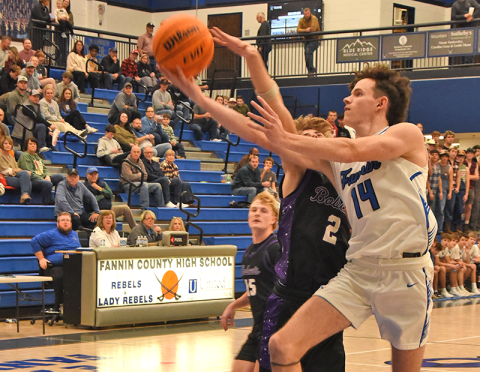 Brody Henson goes for  a layup against Gilmer County.