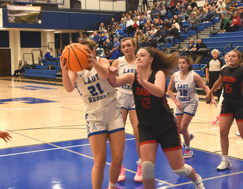 Fannin County’s Maggie Ledford (21) battled Copper Basin’s Kloie Ballew for this rebound. Also shown are Fannin’s Reese Lewis and Toccoa Hampton (12).