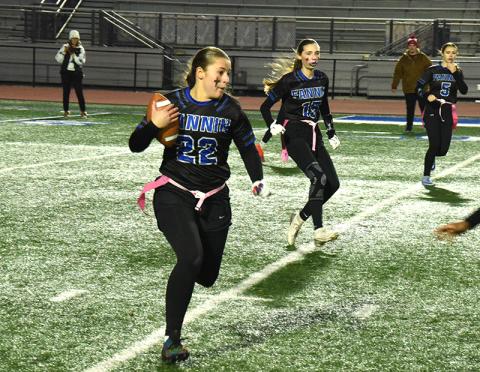 Lady Rebel flag footballer Bridgett Allen (#22) prepares to dodge her Mays County opponent in the state playoff game at home December 4. Lola Temples (#15) and Kendall Gaddis (#5) are also pictured.